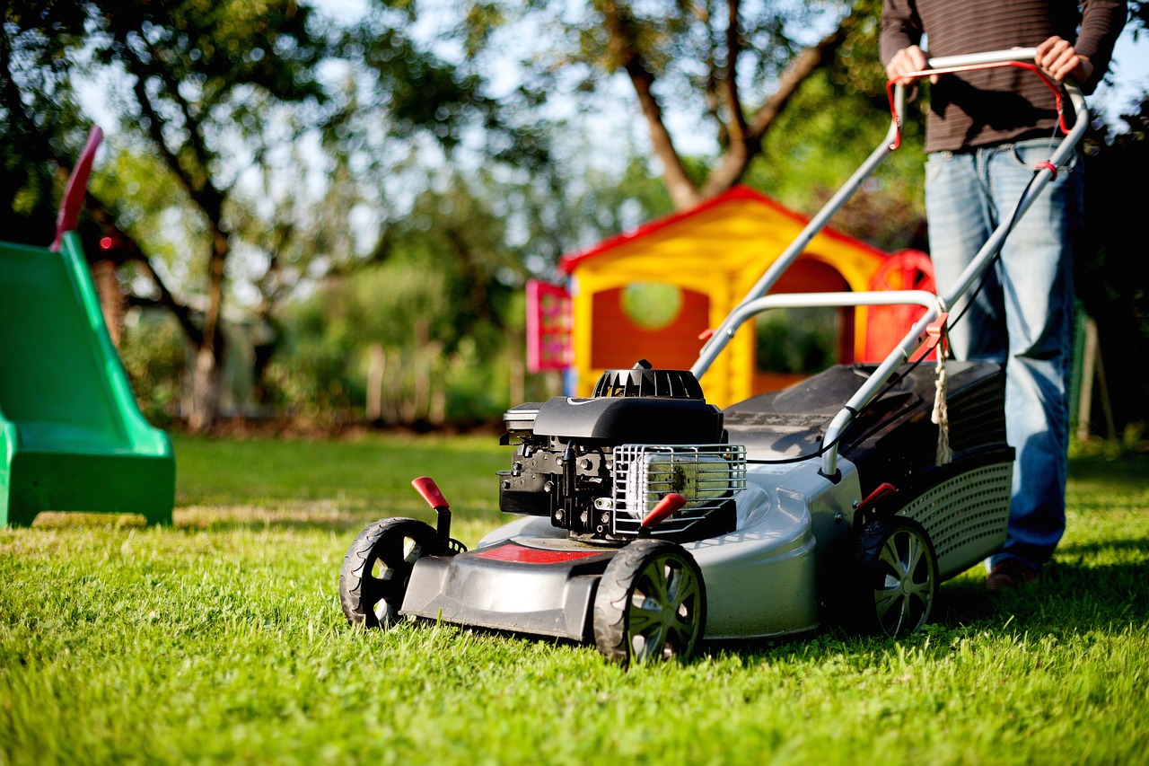 man using a lawn mower